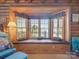 Inviting window seat featuring cushioned seating and decorative pillows and lamp, creating a cozy retreat at 5981 Johnson Rd, Lake Wylie, SC 29710
