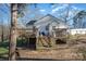 Backyard featuring a deck, yard and a wooden staircase at 800 Woodlawn St, Belmont, NC 28012