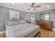 Bedroom featuring hardwood floors, a ceiling fan, and an ensuite bathroom at 800 Woodlawn St, Belmont, NC 28012