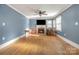 Bright living room with hardwood floors, a fireplace, and a ceiling fan at 800 Woodlawn St, Belmont, NC 28012