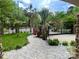 Inviting stone walkway, lush garden, and an iron gate for a secure entrance to the property at 8104 Stem Ct, Charlotte, NC 28227