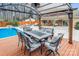 Covered outdoor dining area with comfortable seating, perfect for al fresco meals and relaxation at 8104 Stem Ct, Charlotte, NC 28227