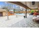 Spacious outdoor living area with a covered patio, swimming pool, stylish furniture, and well-maintained landscaping at 8104 Stem Ct, Charlotte, NC 28227