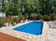 Beautiful in-ground pool surrounded by a large patio, providing ample space for lounging and enjoying sunny days at 8104 Stem Ct, Charlotte, NC 28227