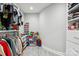 This walk-in closet features built-in shelving and hanging rods for organized storage at 8104 Stem Ct, Charlotte, NC 28227