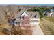 Aerial view of a classic two-story home featuring a manicured lawn and a convenient two-car garage at 8251 Kale Pl, Harrisburg, NC 28075