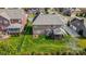 Aerial view of backyard featuring lush lawn, patio, and fence at 8501 Caesars Head Dr, Waxhaw, NC 28173