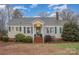 Charming single-story home with a cozy front porch, green shutters, and brick accents at 8639 S Nc Hwy 205 Hwy, Oakboro, NC 28129