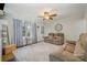 Cozy living room with comfortable seating, a ceiling fan, and lots of natural light at 8639 S Nc Hwy 205 Hwy, Oakboro, NC 28129