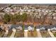 An aerial perspective captures a dense neighborhood filled with mature trees and varied home styles at 910 Elrond Nw Dr, Charlotte, NC 28269