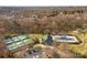 An aerial view of community amenities including tennis courts, swimming pool and clubhouse at 910 Elrond Nw Dr, Charlotte, NC 28269