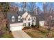 Classic two-story home featuring dormer windows, black shutters and a two car garage at 910 Elrond Nw Dr, Charlotte, NC 28269