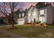 Charming two-story home featuring a well-manicured lawn and a classic architectural design at 910 Elrond Nw Dr, Charlotte, NC 28269
