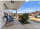 Relaxing front porch with comfortable chairs and a view of the neighborhood street at 9910 Psalms St, Cornelius, NC 28031