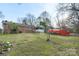 Spacious backyard featuring a brick home, covered porch, shed and expansive yard at 1018 Eaglewood Ave, Charlotte, NC 28212