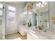 Dual vanity bathroom offers a separate glass enclosed shower and decorative lighting at 10207 Summer House Ct, Charlotte, NC 28210