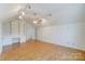 Spacious bonus room featuring built-in bookshelves and ample lighting at 10207 Summer House Ct, Charlotte, NC 28210