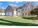 Beautiful two-story house with an attached garage, well-kept lawn, and a welcoming front entrance at 10207 Summer House Ct, Charlotte, NC 28210