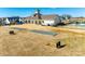 Beautiful community amenities include a lawn, pool, and clubhouse with outdoor gathering space at 1024 Mayapple Way, Belmont, NC 28012