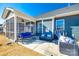 View of the home's blue siding with a screen porch and fenced backyard at 1024 Mayapple Way, Belmont, NC 28012