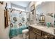 Charming bathroom featuring a stylish vanity with a granite countertop and a mermaid themed shower curtain at 1024 Mayapple Way, Belmont, NC 28012