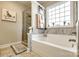 Bathroom featuring glass shower, standalone tub, and tile backsplash at 1024 Mayapple Way, Belmont, NC 28012