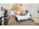 Bright bedroom with a sloped ceiling, carpeted floor, ceiling fan, and comfortable furnishings at 1024 Mayapple Way, Belmont, NC 28012