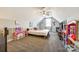 Spacious bedroom with a sloped ceiling, carpeted floor, ceiling fan, and toys at 1024 Mayapple Way, Belmont, NC 28012