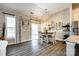 Cozy dining area with hardwood floors, a modern chandelier, and access to the backyard through sliding doors at 1024 Mayapple Way, Belmont, NC 28012