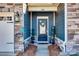 Close-up of a home's entry, showcasing the front door, stone accents, and decorative wreath at 1024 Mayapple Way, Belmont, NC 28012