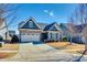 Charming home featuring stone accents, a two-car garage, and well-maintained landscaping at 1024 Mayapple Way, Belmont, NC 28012