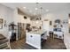 Spacious kitchen featuring stainless steel appliances, island with seating, and white cabinetry at 1024 Mayapple Way, Belmont, NC 28012