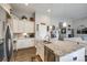 Modern kitchen featuring a large island, stainless steel appliances, and custom cabinetry at 1024 Mayapple Way, Belmont, NC 28012