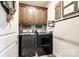 Laundry room featuring modern appliances and ample cabinet space at 1024 Mayapple Way, Belmont, NC 28012