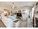 Spacious living room with vaulted ceilings, a large sectional sofa, and a wall-mounted TV at 1024 Mayapple Way, Belmont, NC 28012