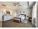 Spacious main bedroom featuring a tray ceiling, ceiling fan, and coordinated furniture set, offering a serene retreat at 1024 Mayapple Way, Belmont, NC 28012