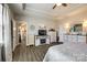 Bright bedroom featuring a fireplace and entertainment center, alongside stylish furnishings and a calming color scheme at 1024 Mayapple Way, Belmont, NC 28012