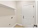 Mud room with white door, tile flooring, and storage at 1055 Curry Way, Matthews, NC 28104