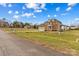 Traditional brick home featuring dormer windows, an attached garage, and a well-manicured lawn at 109 Putney Ct, Salisbury, NC 28147