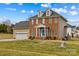 Attractive brick residence featuring dormer windows, attached garage and a well-maintained yard at 109 Putney Ct, Salisbury, NC 28147