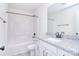 Bathroom featuring granite countertop, white cabinets, modern fixtures, and a shower-tub combo at 111 Megby Trl, Statesville, NC 28677