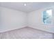 Bedroom featuring a large window, carpeted floors, and neutral colored walls at 111 Megby Trl, Statesville, NC 28677