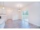 Cozy dining area with hardwood floors, pendant lighting, and sliding glass door at 111 Megby Trl, Statesville, NC 28677