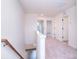 Second floor hallway featuring carpeted floors and many doorways to bedrooms at 111 Megby Trl, Statesville, NC 28677