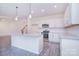 Spacious kitchen with granite countertops, stainless steel appliances, and white cabinets at 111 Megby Trl, Statesville, NC 28677
