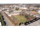 Aerial scene displaying a community of well-maintained townhomes surrounded by greenery at 1127 Central Park Cir, Davidson, NC 28036