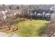 Community grounds showcasing manicured lawns, mature trees, and attractive townhome exteriors at 1127 Central Park Cir, Davidson, NC 28036