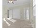 Cozy bedroom with a large closet, carpet flooring, and neutral-colored walls at 1127 Central Park Cir, Davidson, NC 28036