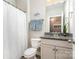 Bathroom with a single vanity, granite countertop, and a shower with a white curtain at 114 Tomahawk Dr, Mooresville, NC 28117