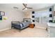 Cozy bedroom featuring a ceiling fan, natural light, and blue accents at 114 Tomahawk Dr, Mooresville, NC 28117